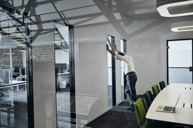 Switchable Glass Redefines Privacy Expectations: But How? Smart glass office partitions creating flexible workspaces with instant privacy control and transparent meeting room solutions.