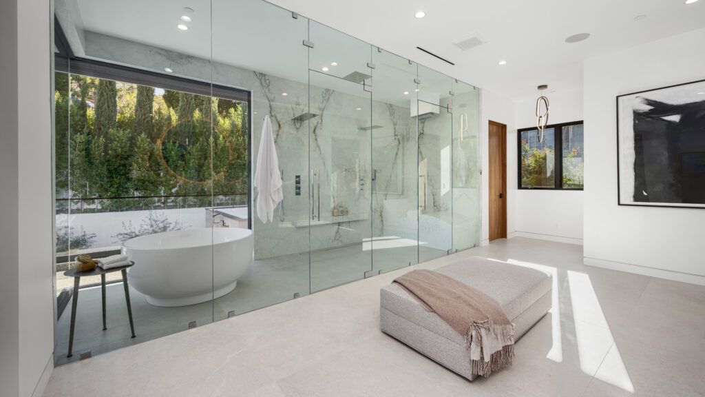 spacious bathroom with a bathtub behind glass pane 2024 02 12 16 13 44 utc