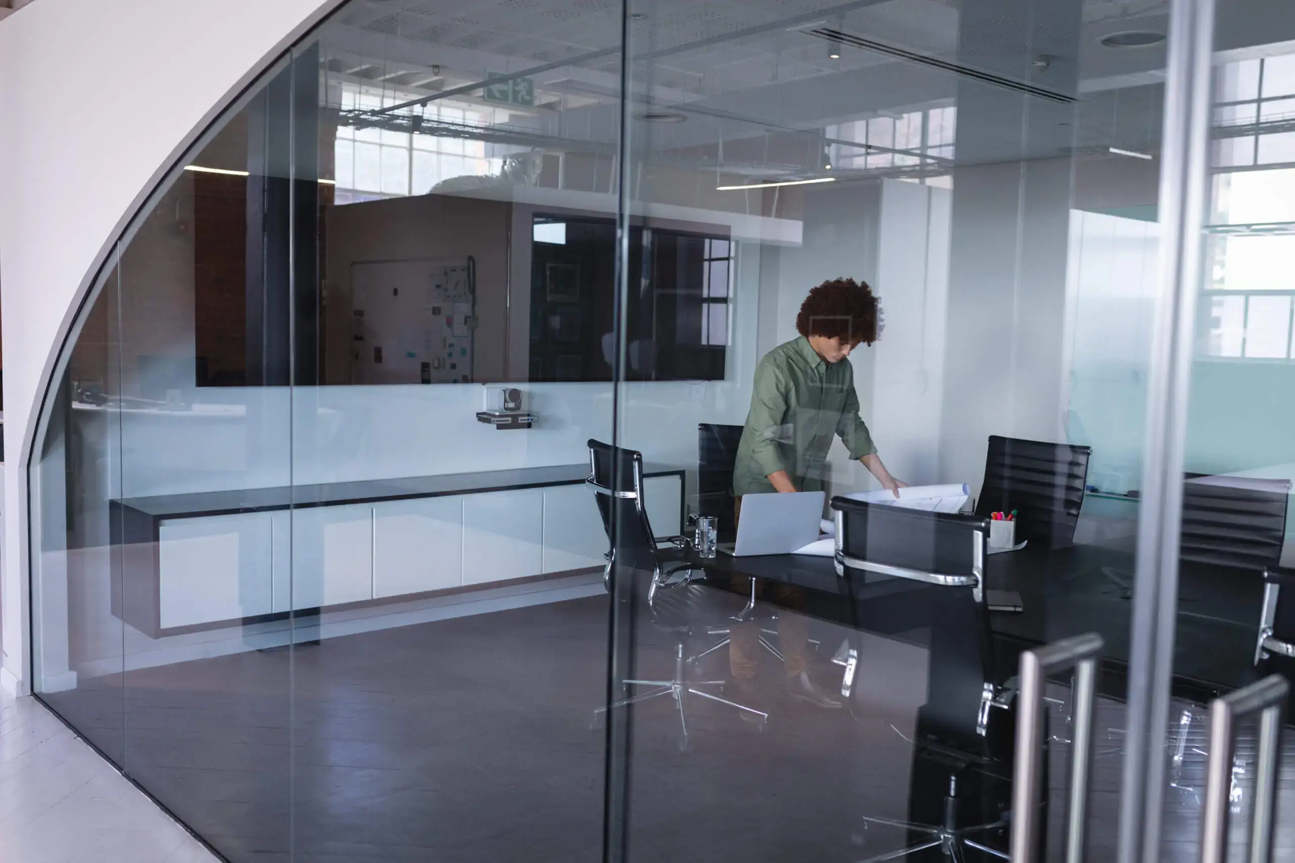 mixed race businessman in meeting room standing ov 2023 11 27 04 54 42 utc scaled 1