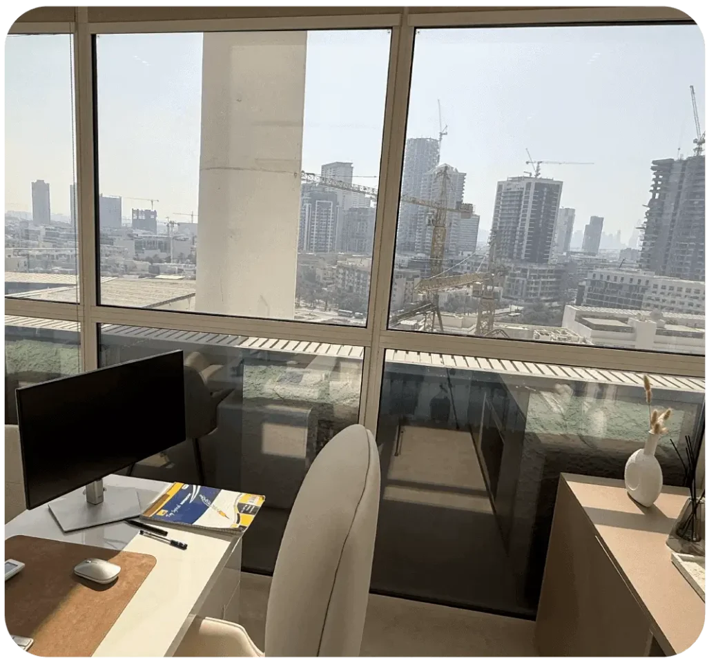 Modern office featuring electrochromic glass windows that automatically adjust tint to control sunlight, reduce glare and improve energy efficiency.
