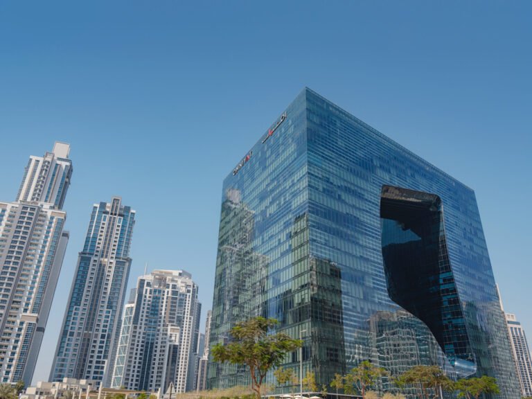 Smart glass for noise reduction installed in a modern commercial building in Dubai.